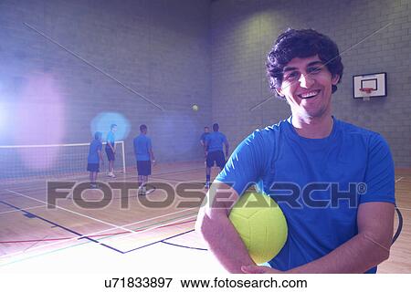 Stock Photo - Soccer player indoors, portrait. Fotosearch