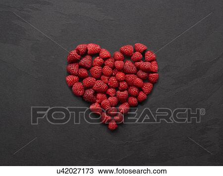 Still life of fresh raspberries arranged in heart shape View Large Photo Image Stock Image - Still life of fresh raspberries arranged in heart shape. Fotosearch