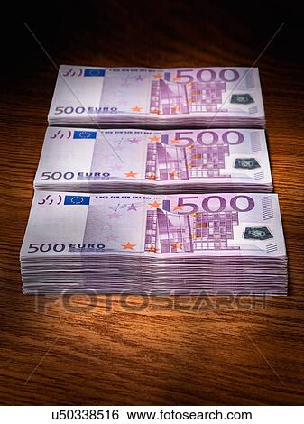 Three stacks of 500 euro bills on office desk View Large Photo Image Stock Photograph - Three stacks of 500 euro bills on office desk. Fotosearch
