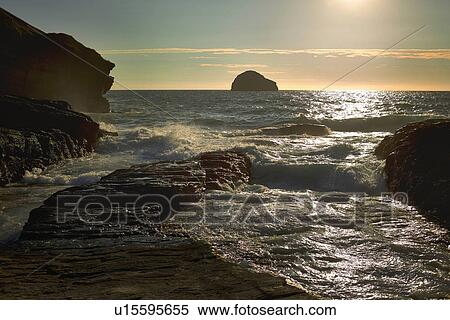 View of rocky cliffs and sea at sunrise, Treknow, Cornwall, UK View Large Photo Image Stock Photography - View of rocky cliffs and sea at sunrise, Treknow, Cornwall, UK. Fotosearch