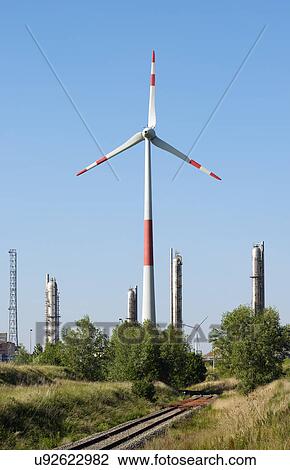 Wind turbine in front of petro-chemical installation in Antwerp harbor, Antwerp, Belgium View Large Photo Image Stock Image - Wind turbine in front of petro-chemical installation in Antwerp harbor, Antwerp, Belgium. Fotosearch