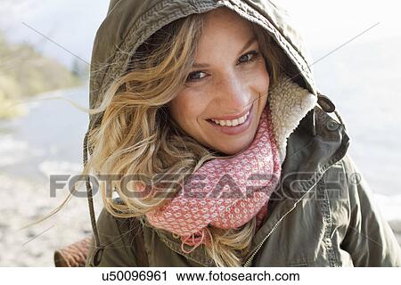 Woman all wrapped up on windy beach View Large Photo Image Stock Image - Woman all wrapped up on windy beach. Fotosearch