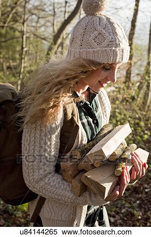 Woman collecting wood for fire by seaside View Large Photo Image Stock Photography - Woman collecting wood for fire by seaside. Fotosearch