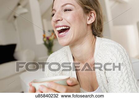 Woman drinking tea View Large Photo Image Stock Image - Woman drinking tea. Fotosearch