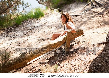 Picture - Woman enjoying nature, The Blue Pool, Wareham, Dorset, United Kingdom. Fotosearch