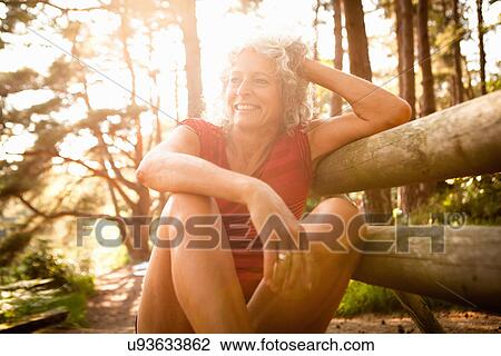 Woman enjoying nature, The Blue Pool, Wareham, Dorset, United Kingdom View Large Photo Image Stock Image - Woman enjoying nature, The Blue Pool, Wareham, Dorset, United Kingdom. Fotosearch