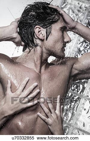 Woman washing man from behind in shower View Large Photo Image Stock Photography - Woman washing man from behind in shower. Fotosearch