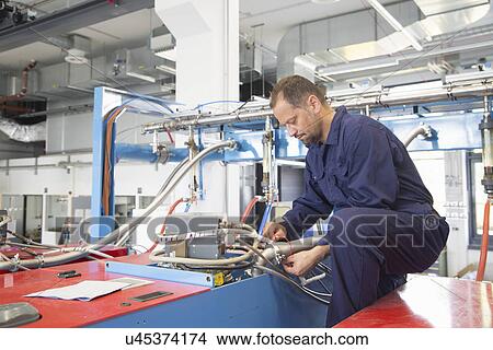 Worker in industrial plant View Large Photo Image Picture - Worker in industrial plant. Fotosearch