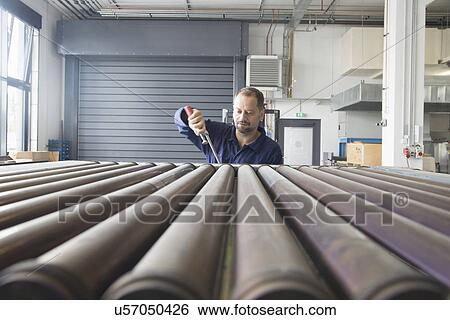 Worker in industrial plant View Large Photo Image Stock Photograph - Worker in industrial plant. Fotosearch