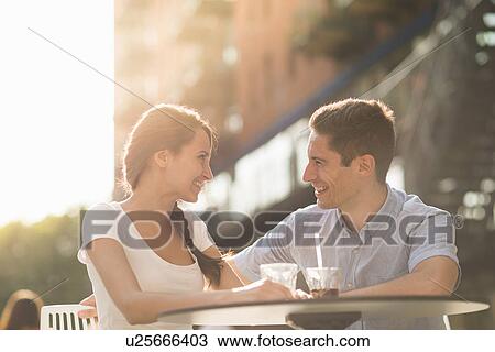 Young couple at cafe View Large Photo Image Stock Image - Young couple at cafe. Fotosearch