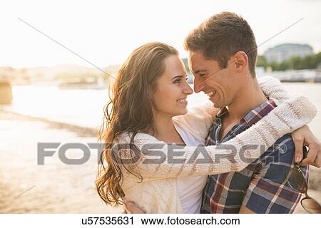 Stock Image - Young couple hugging. Fotosearch