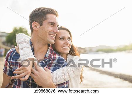 Young couple hugging View Large Photo Image Stock Photograph - Young couple hugging. Fotosearch