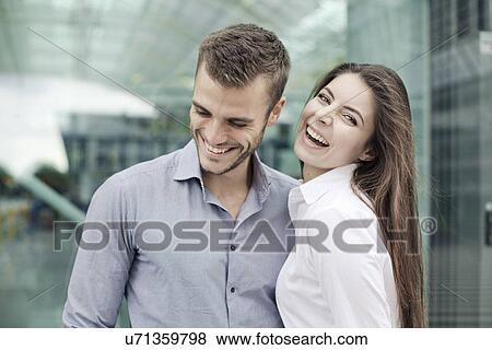Stock Photo - Young couple laughing. Fotosearch