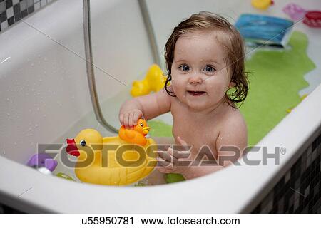 Stock Image - Young girl in bath. Fotosearch