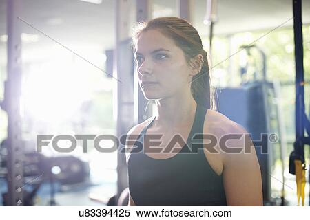 Stock Photography - Young woman looking away, portrait. Fotosearch