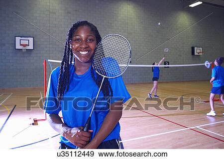 Young woman on badminton court, portrait View Large Photo Image Stock Photo - Young woman on badminton court, portrait. Fotosearch