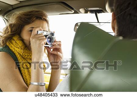 Young woman photographing boyfriend driving, Cape Town, Western Cape, South Africa View Large Photo Image Stock Image - Young woman photographing boyfriend driving, Cape Town, Western Cape, South Africa. Fotosearch