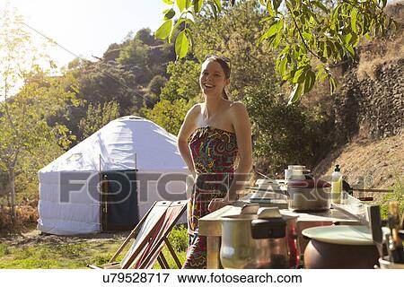 Young woman preparing food whilst glamping, Sierra Nevada, Andalucia Granada, Spain View Large Photo Image Stock Photo - Young woman preparing food whilst glamping, Sierra Nevada, Andalucia Granada, Spain. Fotosearch