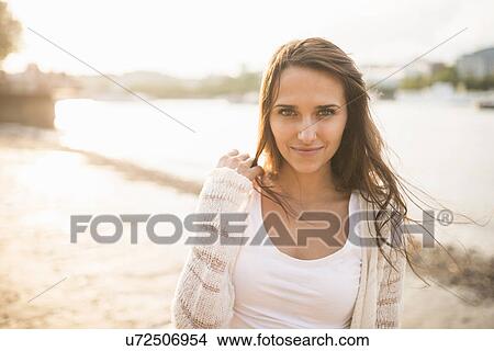 Picture - Young woman with brown hair, portrait. Fotosearch