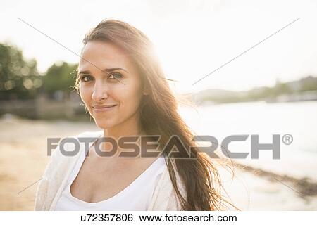Young woman with brown hair, portrait View Large Photo Image Stock Photograph - Young woman with brown hair, portrait. Fotosearch