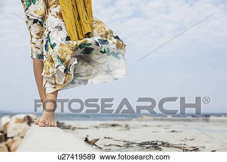 Young womans legs walking along cement block on beach, Cape Town, Western Cape, South Africa View Large Photo Image Stock Photo - Young womans legs walking along cement block on beach, Cape Town, Western Cape, South Africa. Fotosearch