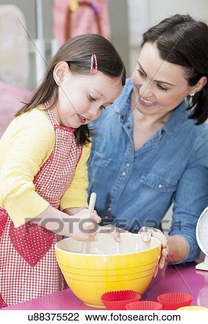 Mother and daughter baking View Large Photo Image Stock Image - Mother and daughter baking. Fotosearch
