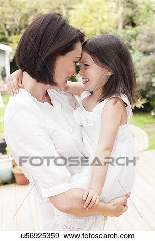 Stock Photo - Mother and daughter hugging. Fotosearch