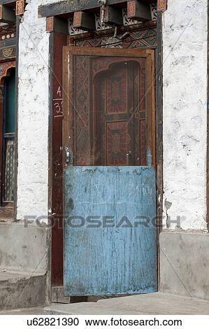 Stock Image - Architectural detail of a doorway, Bhutan. Fotosearch