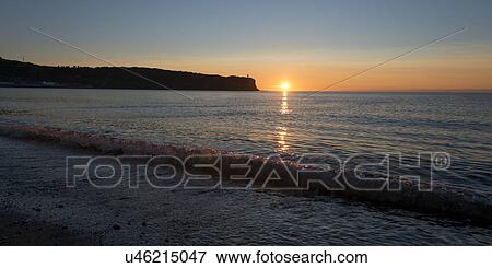 Stock Photo - Beach at sunset, Trout River, Gros Morne National Park, Newfoundland and Labrador, Canada. Fotosearch