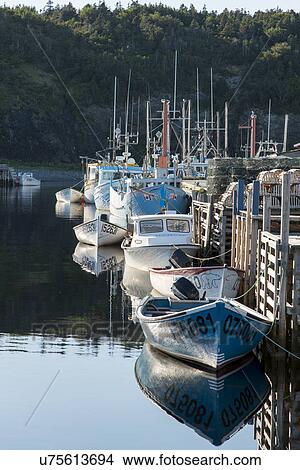 Picture - Boats at dock, Trout River, Southeast Brook Falls, Gros Morne National Park, Newfoundland and Labrador, Canada. Fotosearch