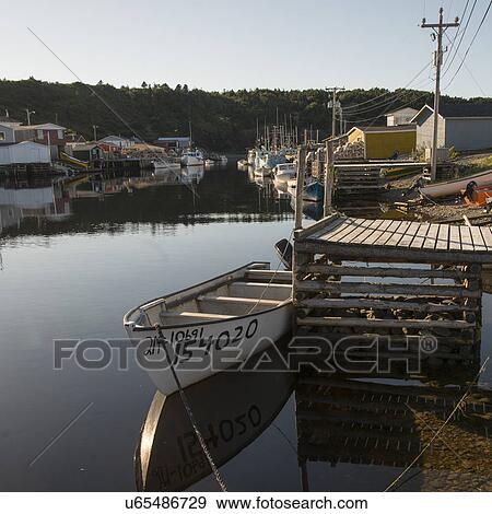 Stock Photo - Boats at dock, Trout River, Southeast Brook Falls, Gros Morne National Park, Newfoundland and Labrador, Canada. Fotosearch