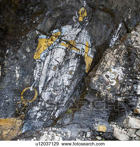Buddha paintings on a rock surface in Bhutan, View Large Photo Image Stock Photo - Buddha paintings on a rock surface in Bhutan,. Fotosearch