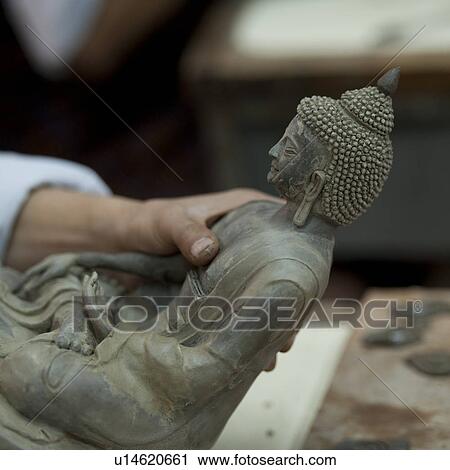 Stock Image - Buddha statue at Thirteen Arts and Crafts School in Bhutan. Fotosearch