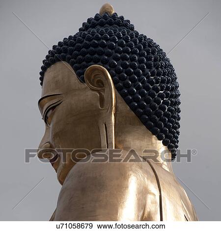 Stock Photo - Buddha statue in Bhutan, Asia. Fotosearch
