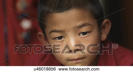 Close-up of a boy in Zilukha Nunnery, Thimphu, Bhutan View Large Photo Image Stock Photograph - Close-up of a boy in Zilukha Nunnery, Thimphu, Bhutan. Fotosearch