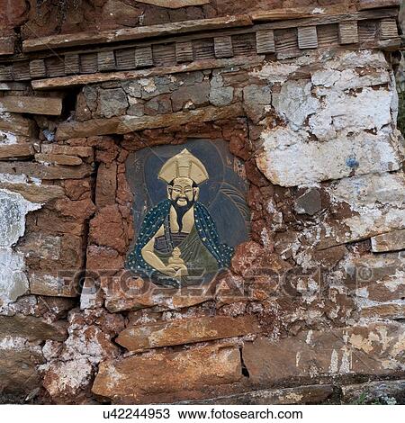Stock Image - Close-up of a painting on a weathered wall of Zurig Dzong, Paro Valley, Paro District, Bhutan. Fotosearch