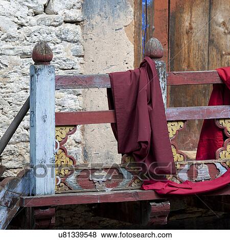 Stock Photo - Cloth draped over a rail in Wangdichholing Palace Bhutan. Fotosearch