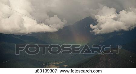 Stock Photo - Clouds over mountains, Dochula Pass, Thimphu, Bhutan. Fotosearch