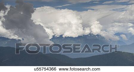 Stock Photograph - Clouds over mountains, Dochula Pass, Thimphu, Bhutan. Fotosearch