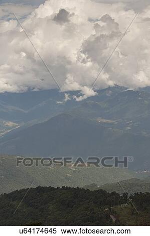 Stock Photography - Clouds over mountains, Dochula Pass, Thimphu, Bhutan. Fotosearch
