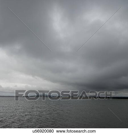 Stock Image - Clouds over Shallow Bay, Cow Head, Gros Morne National Park, Newfoundland and Labrador, Canada. Fotosearch