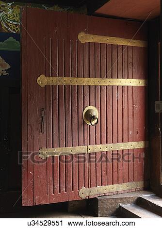 Stock Image - Door of a monastery at Rinpung Dzong, Paro Valley, Paro District, Bhutan. Fotosearch