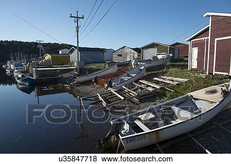 Stock Photo - Fishing boats at dock, Trout River, Southeast Brook Falls, Gros Morne National Park, Newfoundland and Labrador, Canada. Fotosearch