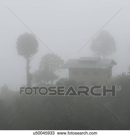 Stock Image - Fog over landscape in Bhutan, Punakha Valley. Fotosearch