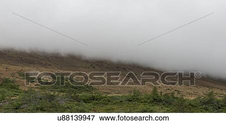 Stock Photo - Fog over tablelands, Gros Morne National Park, Newfoundland and Labrador, Canada. Fotosearch