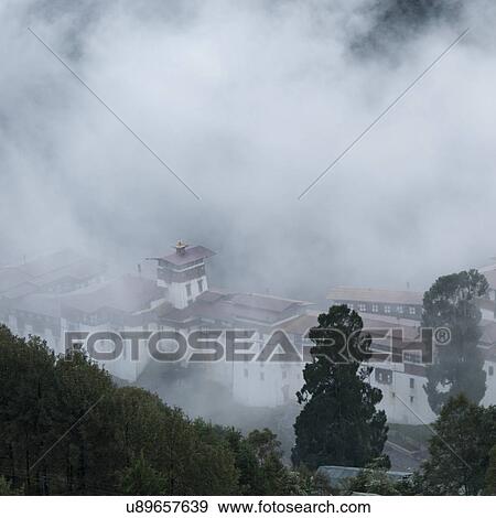 Stock Photo - Fog over Trongsa District in Bhutan. Fotosearch