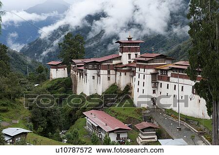 Stock Image - Fog over Trongsa Dzong, Trongsa, Bhutan. Fotosearch