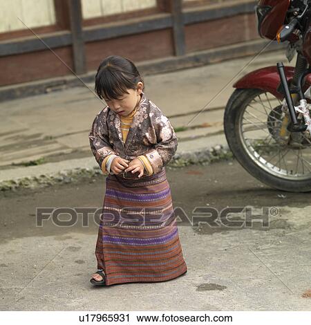 Girl standing on the road, Chokhor Town, Bumthang District, Bhutan View Large Photo Image Stock Image - Girl standing on the road, Chokhor Town, Bumthang District, Bhutan. Fotosearch
