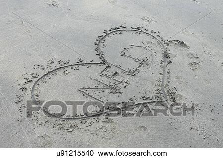 Stock Image - Heart drawn in the sand, Shallow Bay, Gros Morne National Park, Newfoundland and Labrador, Canada. Fotosearch