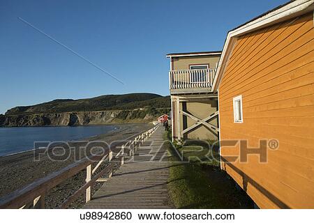 Stock Image - Houses at coast, Trout River, Southeast Brook Falls, Gros Morne National Park, Newfoundland and Labrador, Canada. Fotosearch